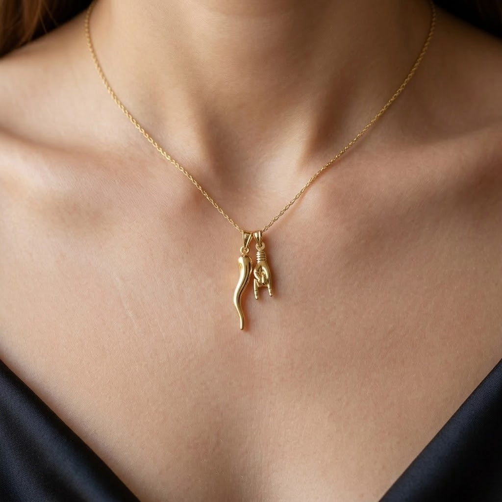 women wearing gold italian horn and hand necklace 
